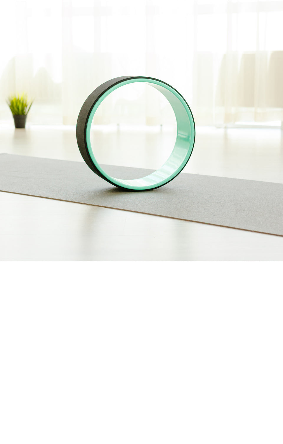  A round object on a yoga mat, evoking mindfulness in a fitness space.